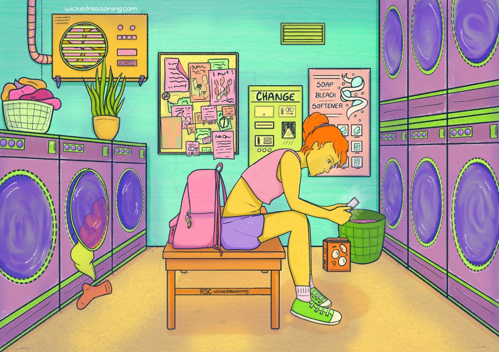 woman waiting for laundry at the laundromat